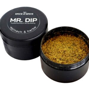 Sort beholder med "MR. DIP" label. Åben låg viser grøn-brun krydderiblanding til dip og dressing.