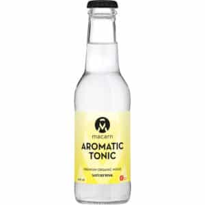 Flaske med sort låg og gul etiket, "Macarn Aromatic Tonic," fremhæver økologisk oprindelse.